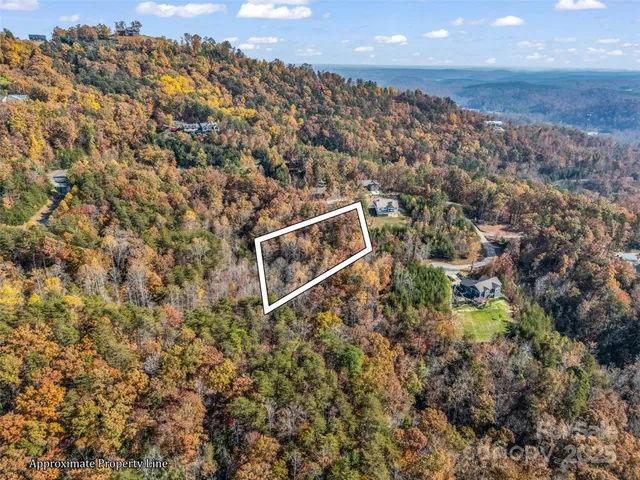 an aerial view of house with yard