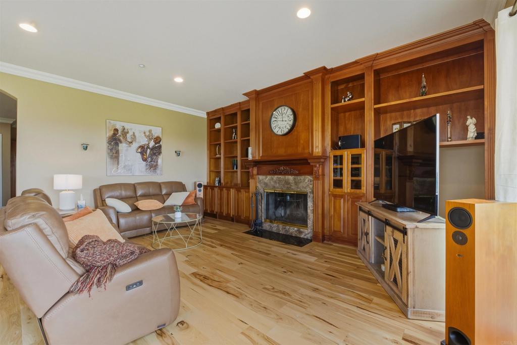 4712 Briana Court Fallbrook, CA 92028 - Photo 18 of 40 a living room with furniture and a fireplace