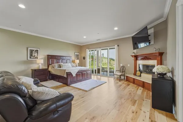a bedroom with furniture and a fireplace
