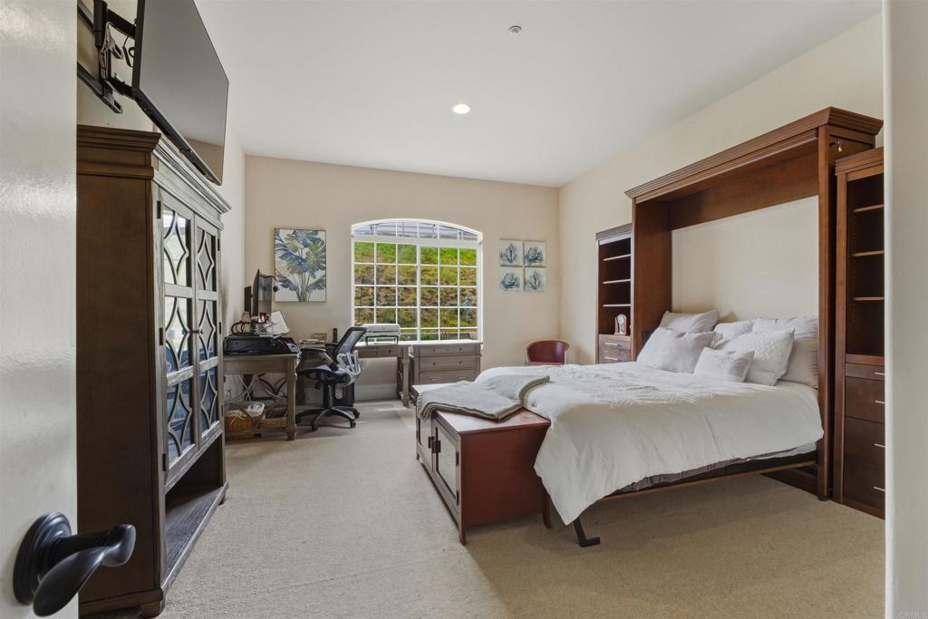 4712 Briana Court Fallbrook, CA 92028 - Photo 33 of 40 a bedroom with bed couch and window
