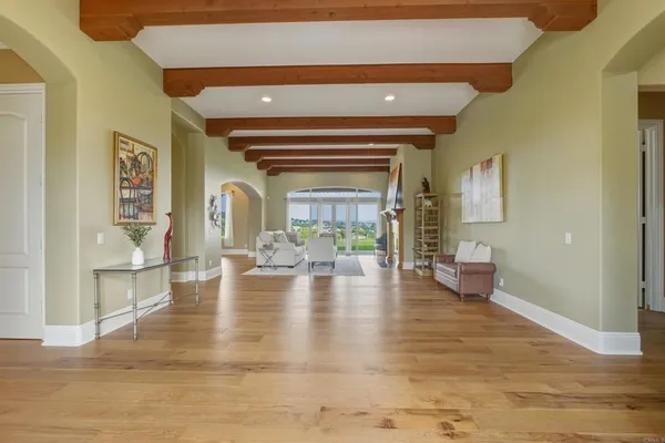 a view of livingroom with furniture wooden floor and windows