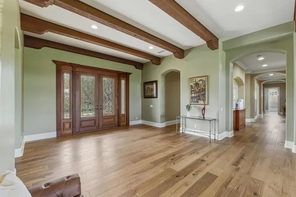 a view of livingroom with hardwood floor and hallway