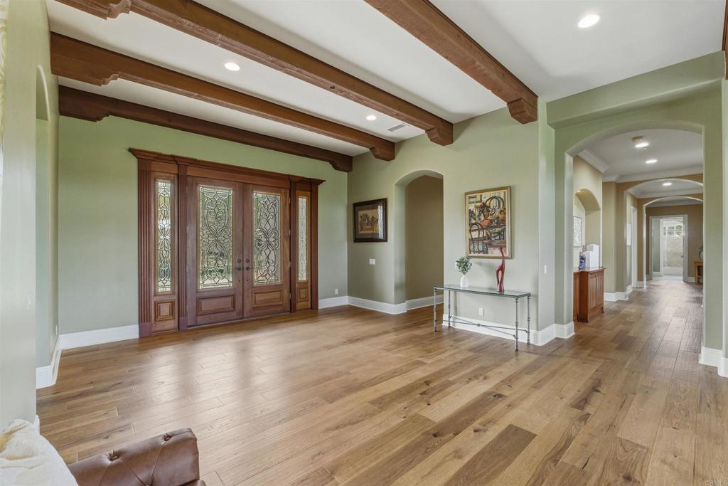 4712 Briana Court Fallbrook, CA 92028 - Photo 7 of 40 a view of livingroom with hardwood floor and hallway