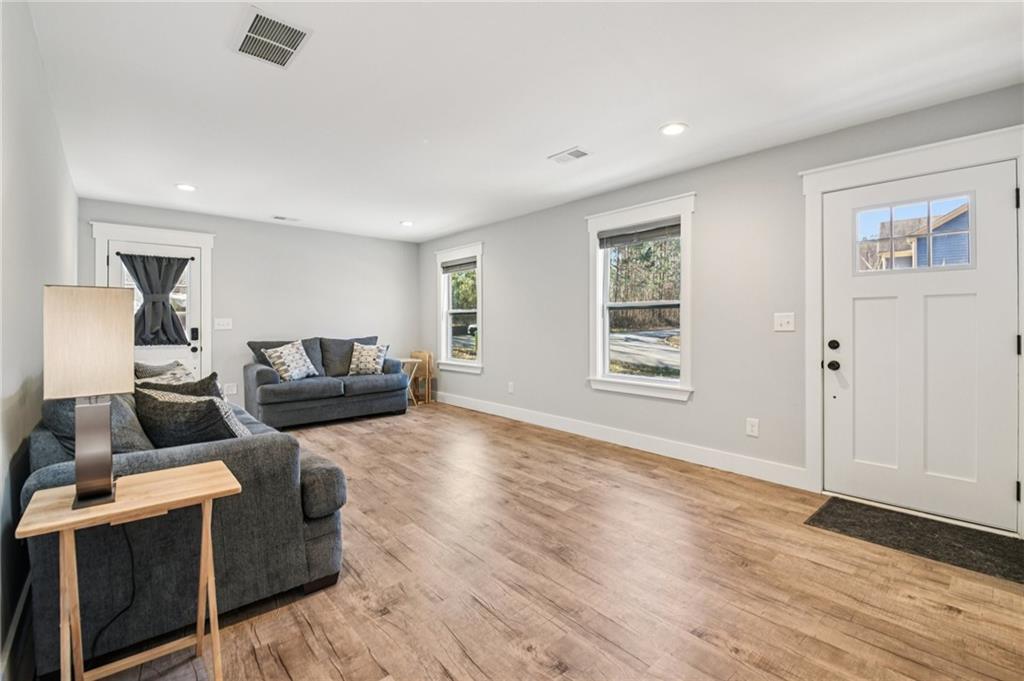 985 Timber Trail Austell, GA 30168 - Photo 2 of 15 a living room with furniture and a wooden floor