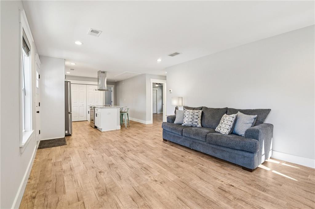 985 Timber Trail Austell, GA 30168 - Photo 3 of 15 a living room with furniture and a wooden floor