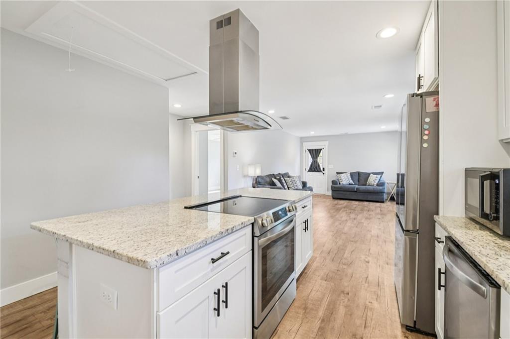 985 Timber Trail Austell, GA 30168 - Photo 6 of 15 a kitchen with stainless steel appliances granite countertop a stove and a sink