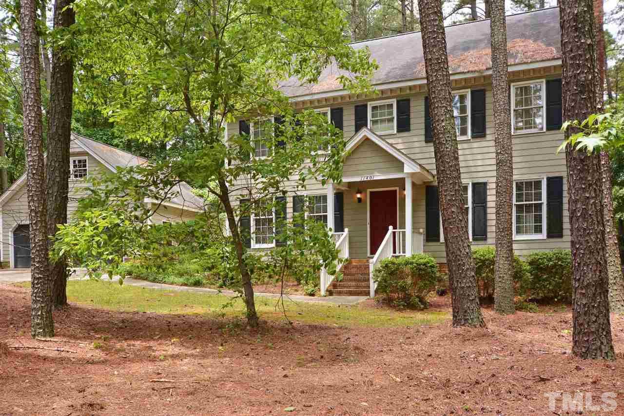 11401 Six Forks Road Raleigh, NC 27614 - Photo 22 of 26 a front view of a house with garden