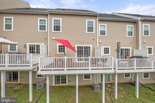 a front view of a house with a deck