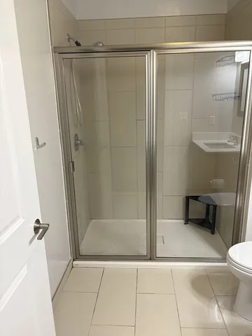 a bathroom with a shower and a toilet