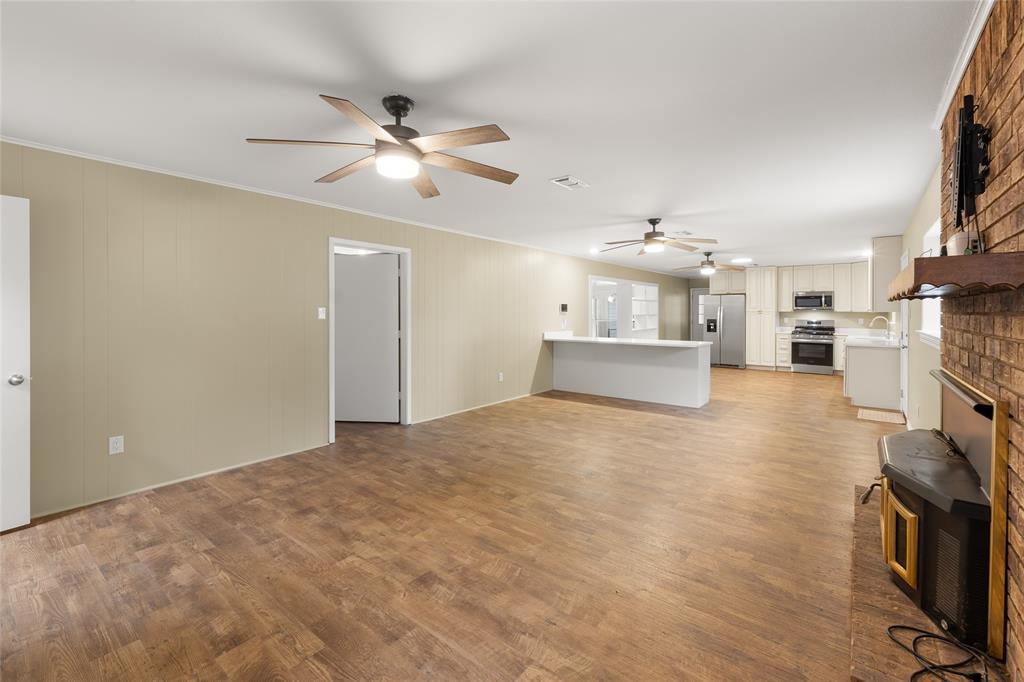 1621 Baseball Loop Diana, TX 75640 - Photo 12 of 38 a view of a kitchen with a sink and a stove top oven