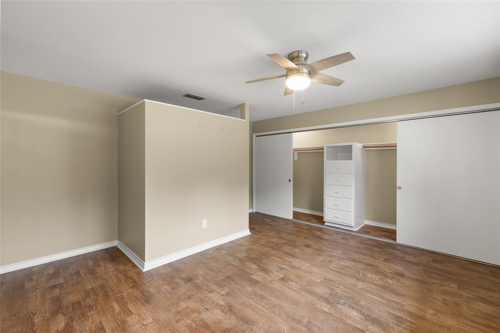 1621 Baseball Loop Diana, TX 75640 - Photo 15 of 38 a view of an empty room with a ceiling fan