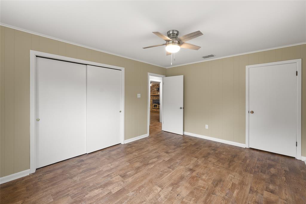 1621 Baseball Loop Diana, TX 75640 - Photo 19 of 38 a view of an empty room with a fan