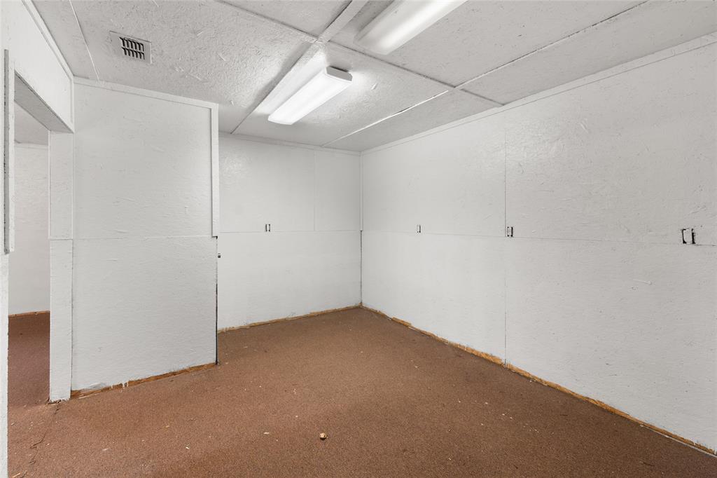 1621 Baseball Loop Diana, TX 75640 - Photo 29 of 38 an empty room with a empty space and windows