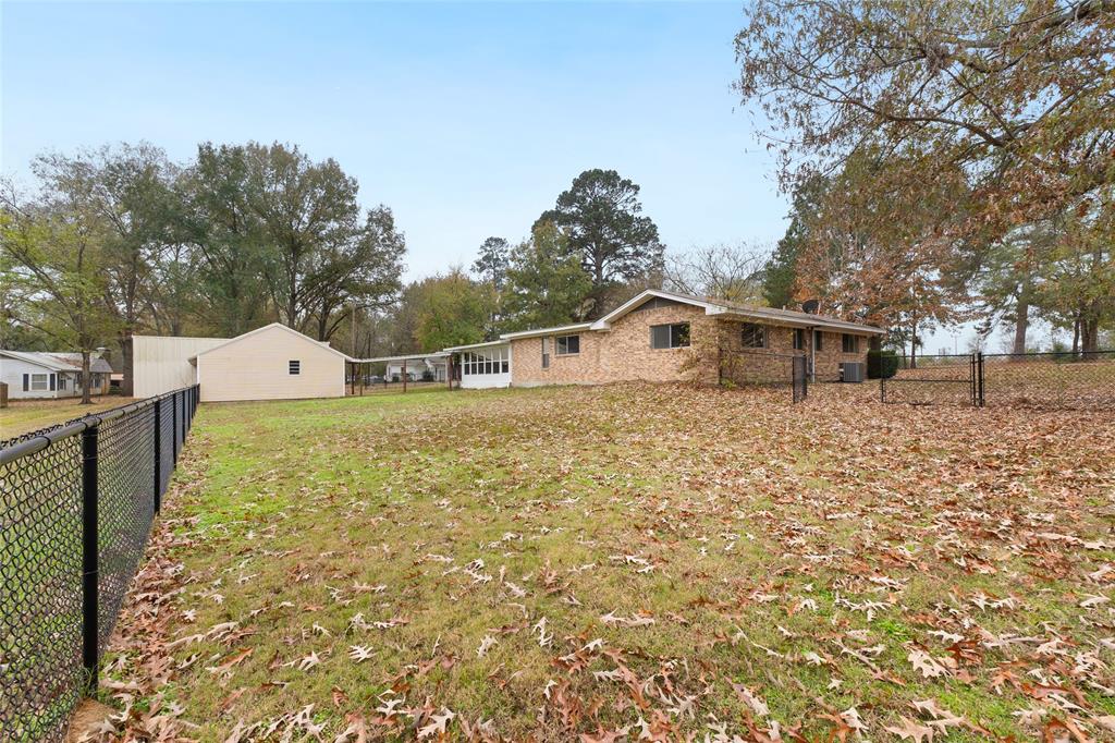1621 Baseball Loop Diana, TX 75640 - Photo 38 of 38 a blue and white house with a yard