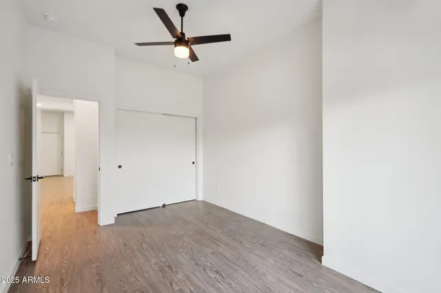 a view of a room with wooden floor