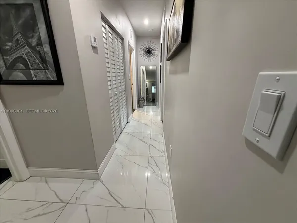 a view of hallway with stairs