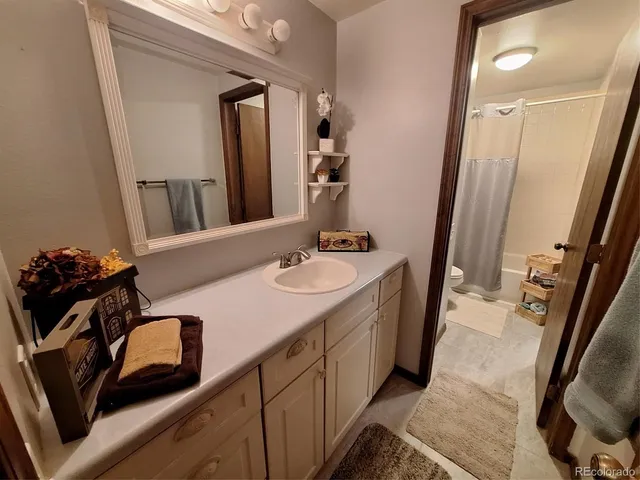 a bathroom with a sink a double vanity and a mirror