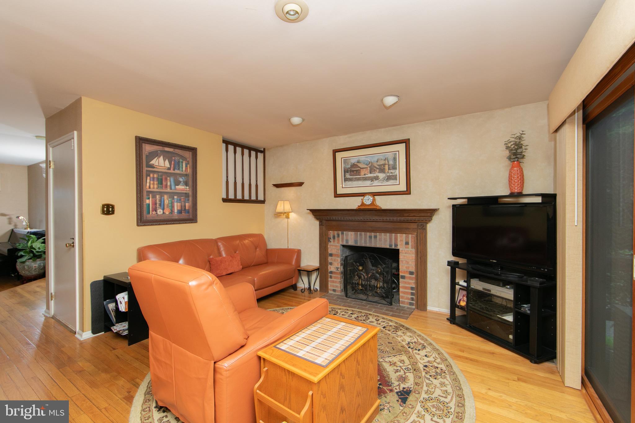 1 Crofton Commons Cherry Hill, NJ 08034 - Photo 11 of 40 a living room with furniture a flat screen tv and a fireplace