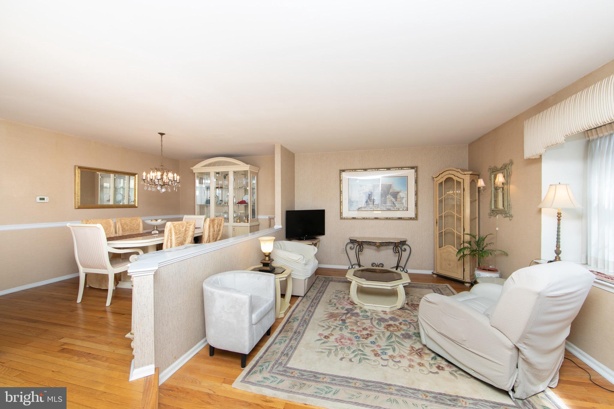 1 Crofton Commons Cherry Hill, NJ 08034 - Photo 2 of 40 a living room with furniture a rug and a chandelier