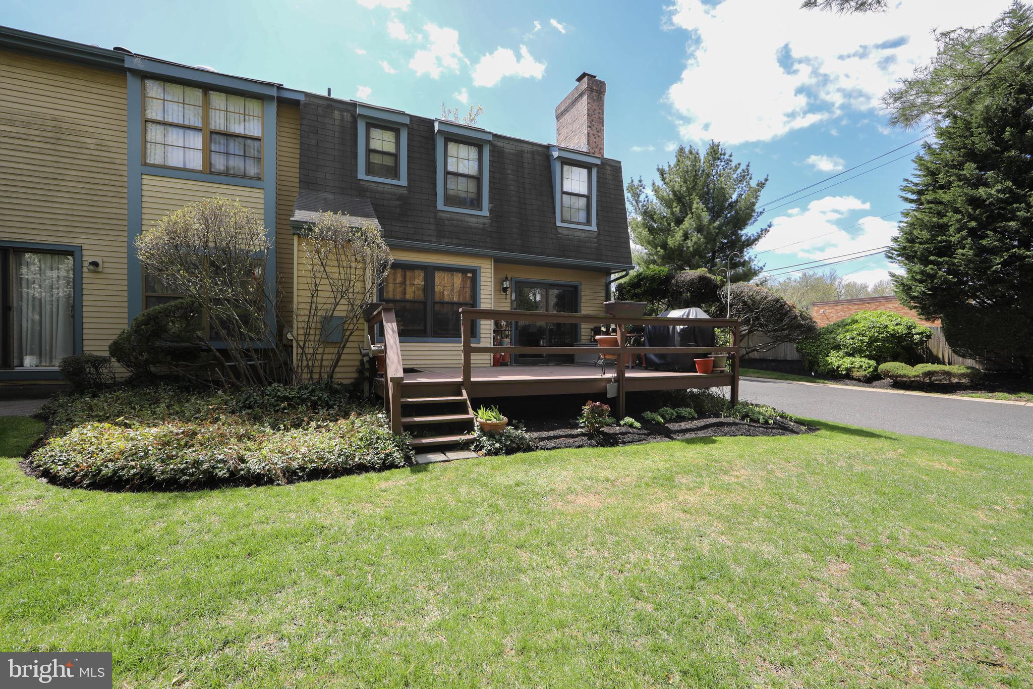 1 Crofton Commons Cherry Hill, NJ 08034 - Photo 33 of 40 a backyard of a house with yard and outdoor seating