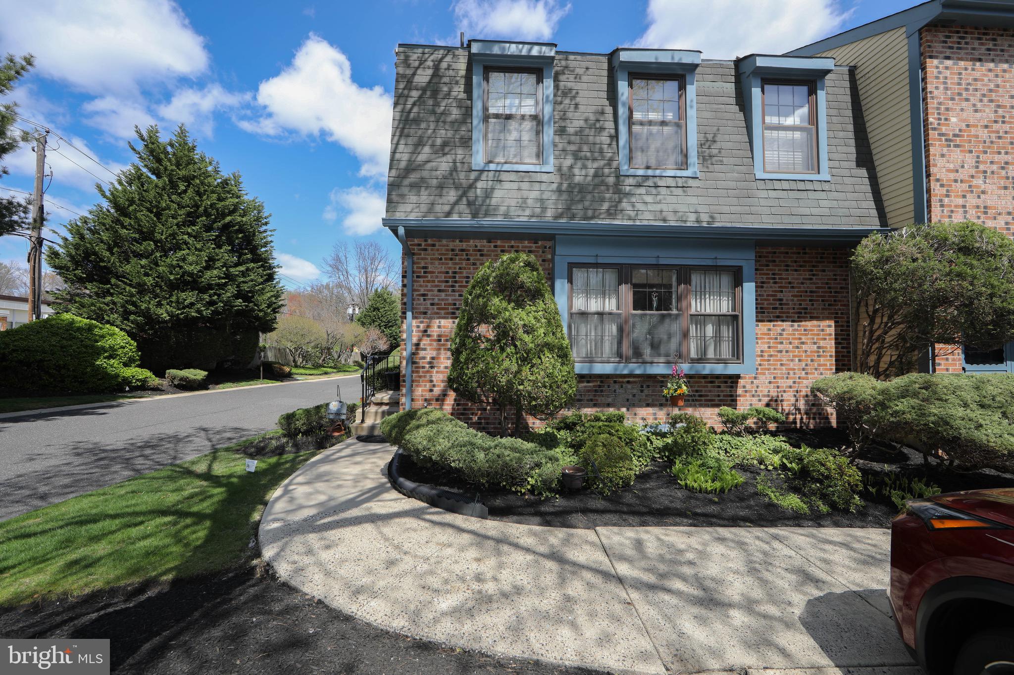 1 Crofton Commons Cherry Hill, NJ 08034 - Photo 34 of 40 a view of a house with potted plants and a fountain