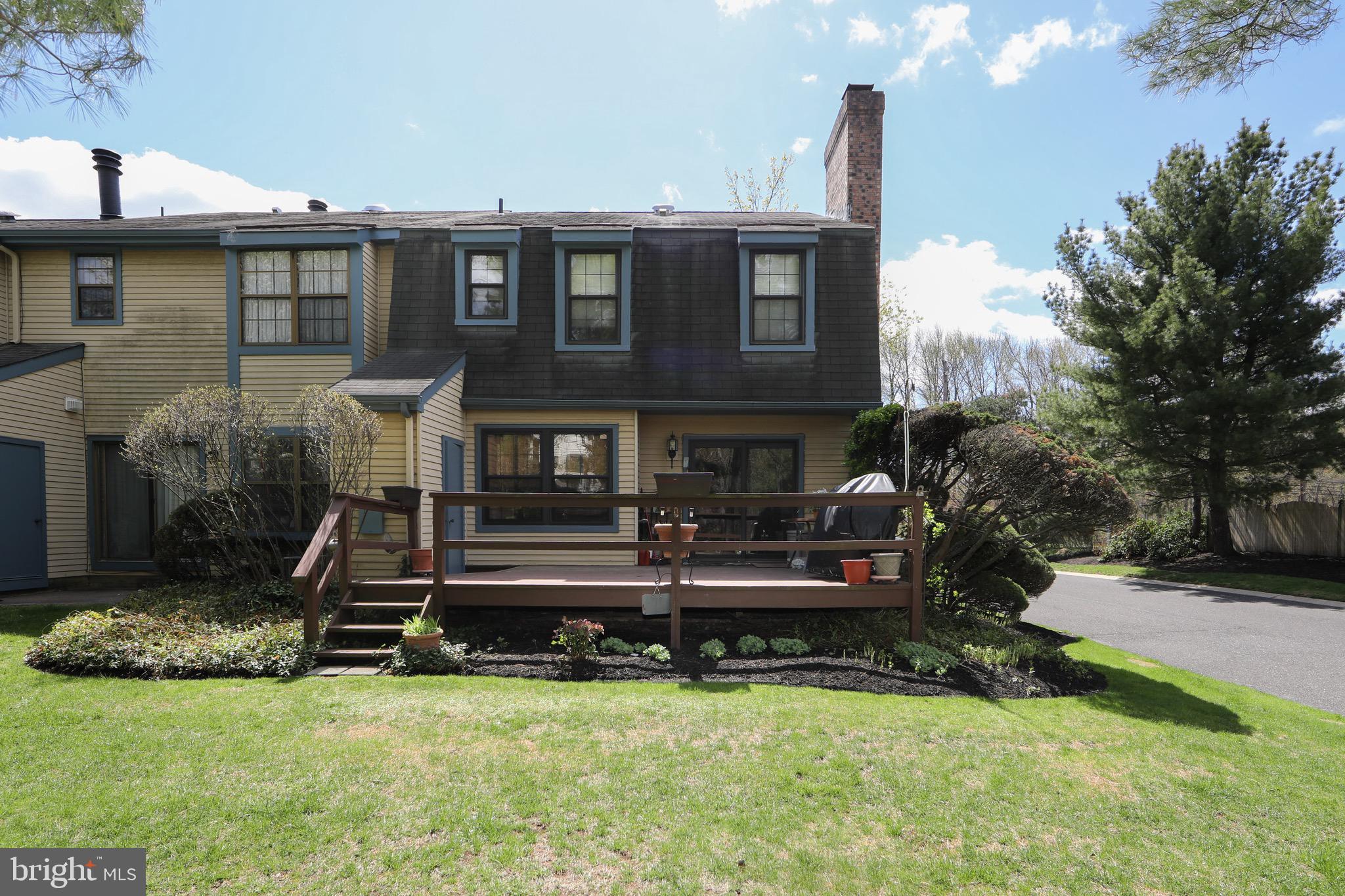 1 Crofton Commons Cherry Hill, NJ 08034 - Photo 39 of 40 a front view of a house with a yard table and chairs