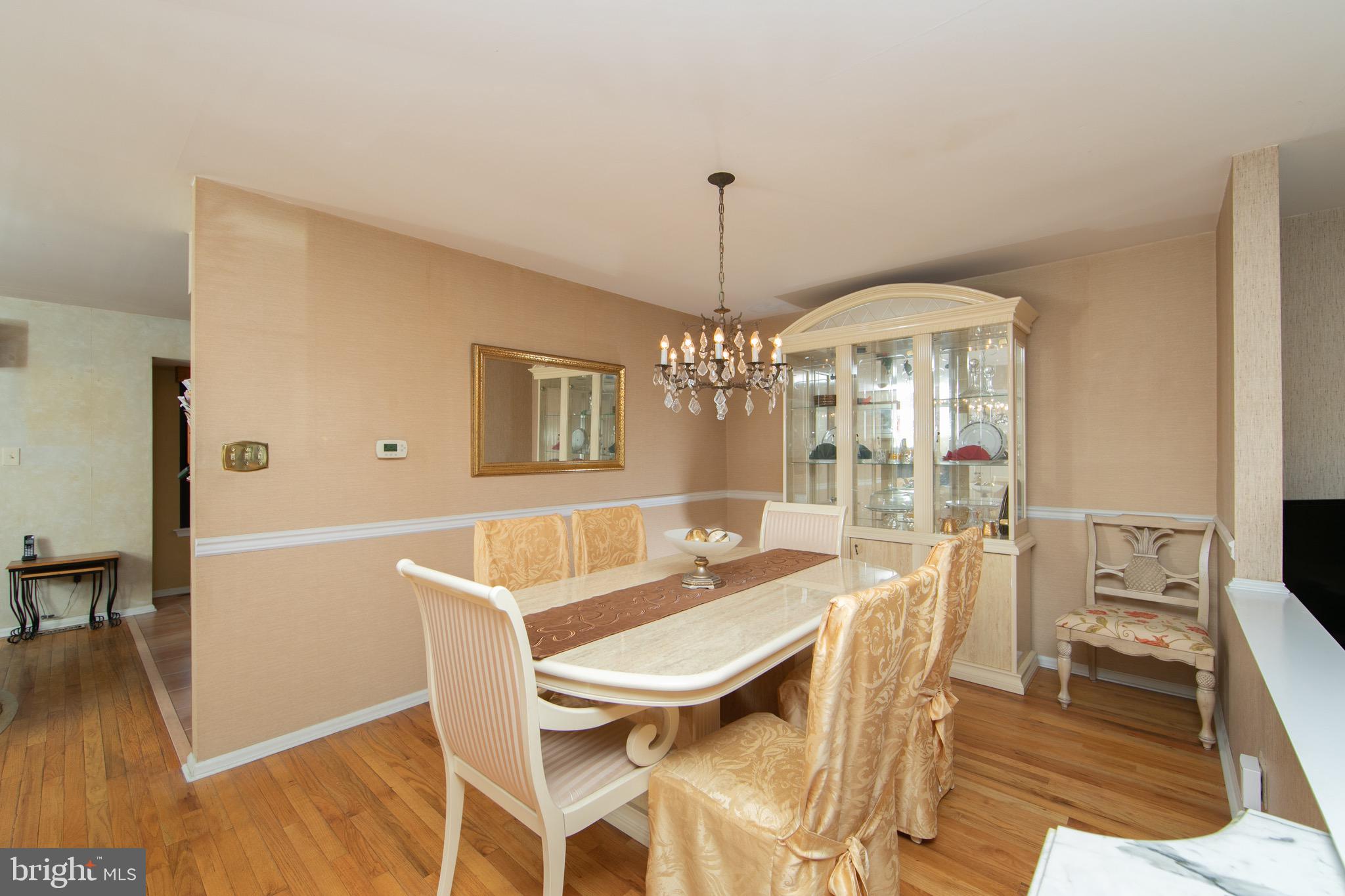 1 Crofton Commons Cherry Hill, NJ 08034 - Photo 6 of 40 a view of a dining room with furniture wooden floor and chandelier