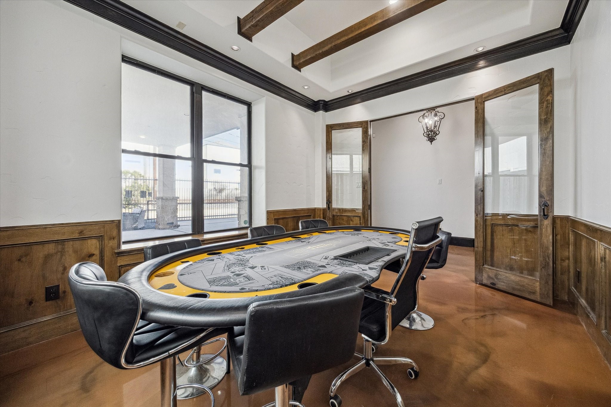 4119 Allen Street Houston, TX 77007 - Photo 3 of 42 Conference room off the entrance of the home features wood paneling and ceiling beams.