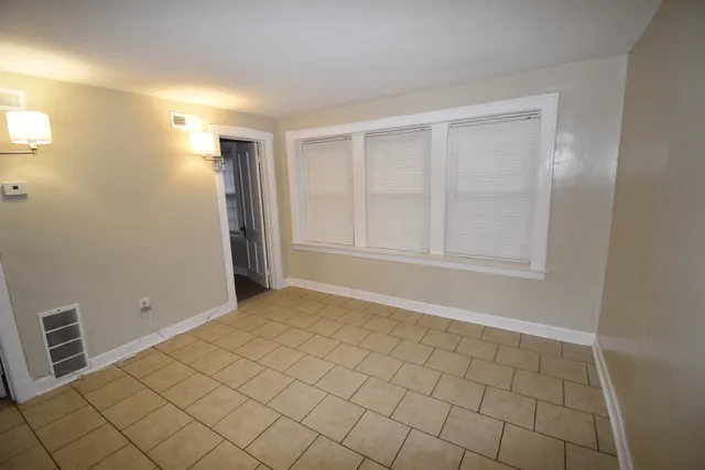 a view of an empty room and window