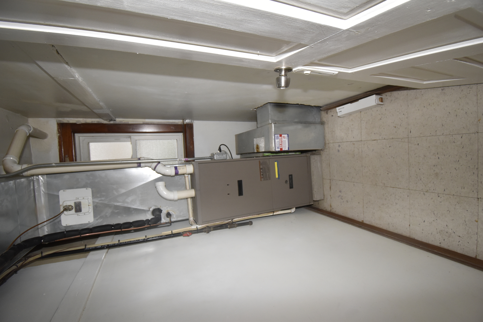 2448 South Homan Avenue, Unit 1 Chicago, IL 60623 - Photo 10 of 12 a room with stainless steel appliances a sink and a stove