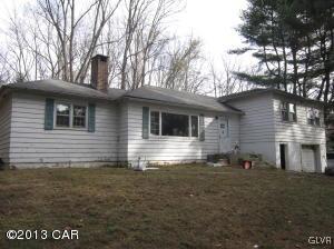 167 Independence Road East Stroudsburg, PA 18301 - Photo 1 of 11 a backyard of a house with table and chairs