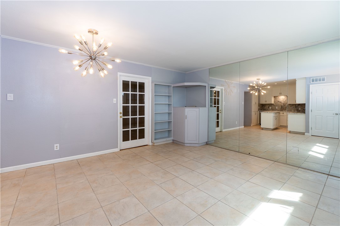 6232 Weber Road Corpus Christi, TX 78413 - Photo 6 of 23 a view of a livingroom with a chandelier fan and windows