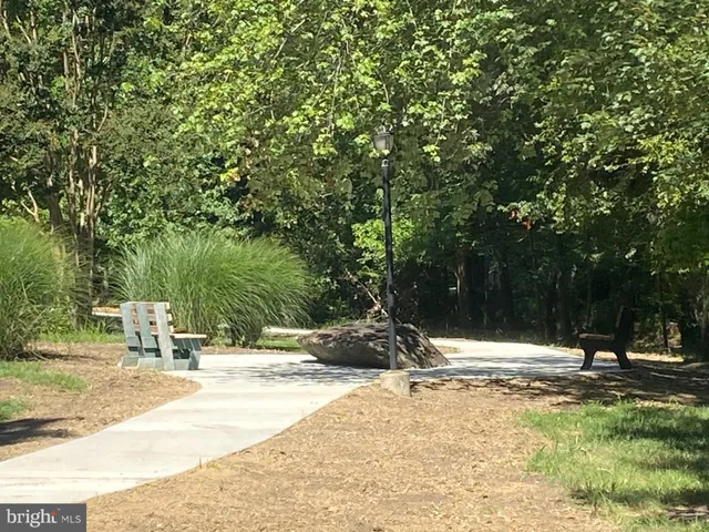 a view of a room with lots of furniture and chandelier