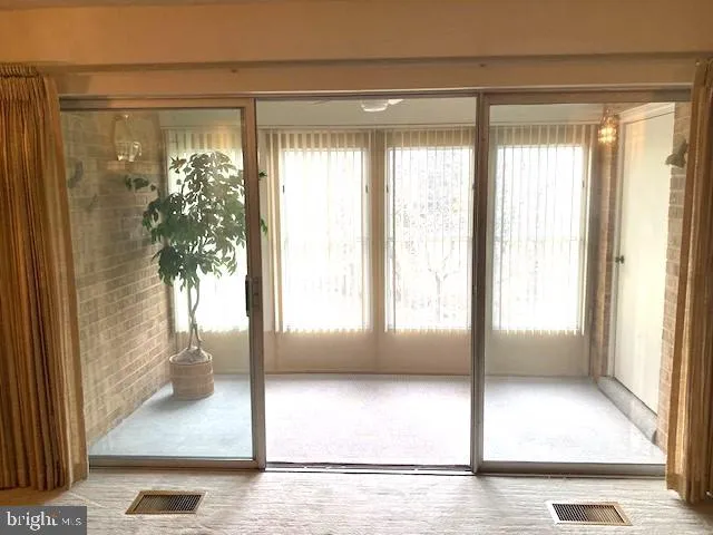 a view of an empty room and window