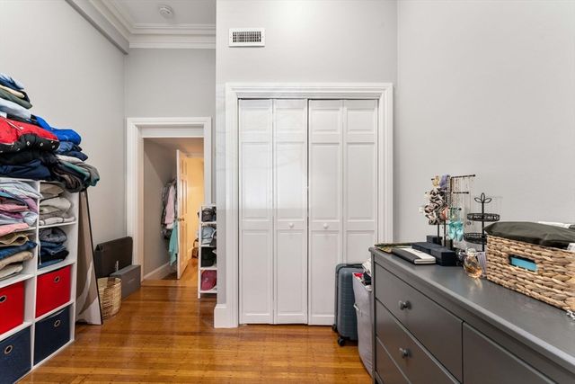 a view of a kitchen with fridge and rack