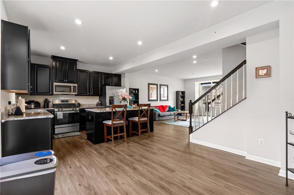 327 Helenium Drive Mars, PA 16046 - Photo 11 of 35 a living room with stainless steel appliances furniture and a view of kitchen