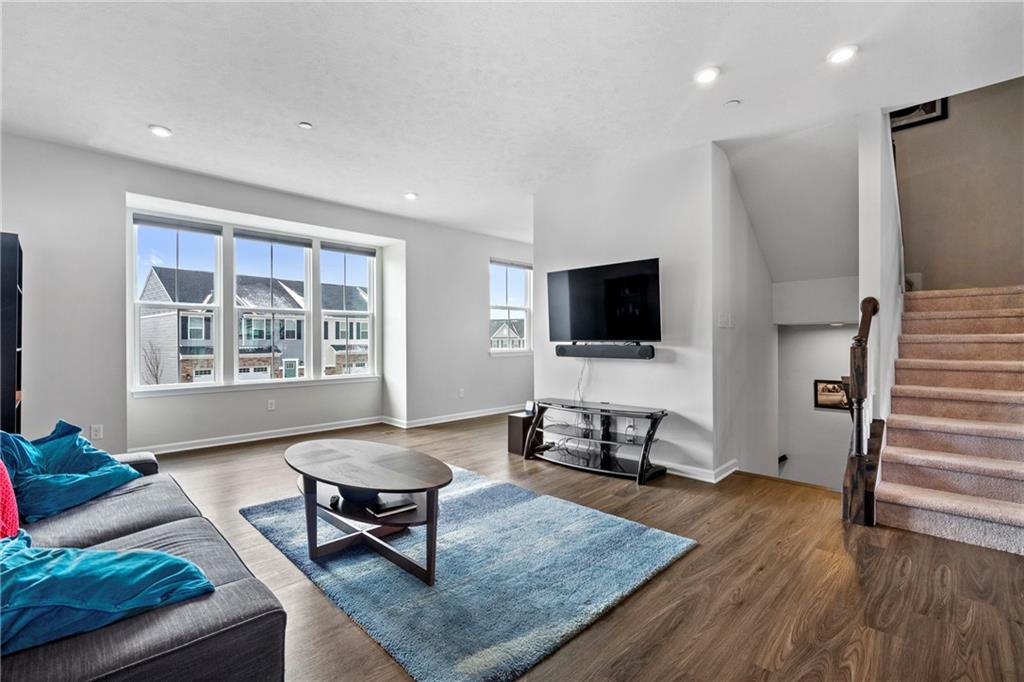 327 Helenium Drive Mars, PA 16046 - Photo 12 of 35 a living room with furniture and a flat screen tv