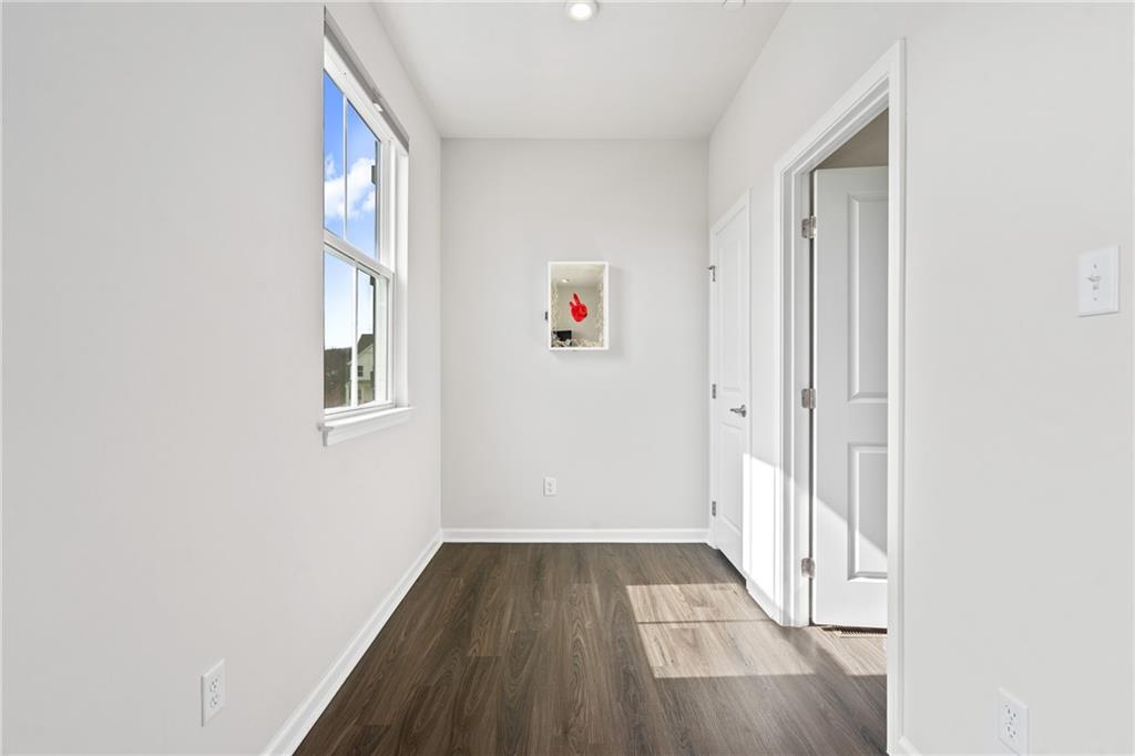 327 Helenium Drive Mars, PA 16046 - Photo 13 of 35 an entryway to room with wooden floor and windows