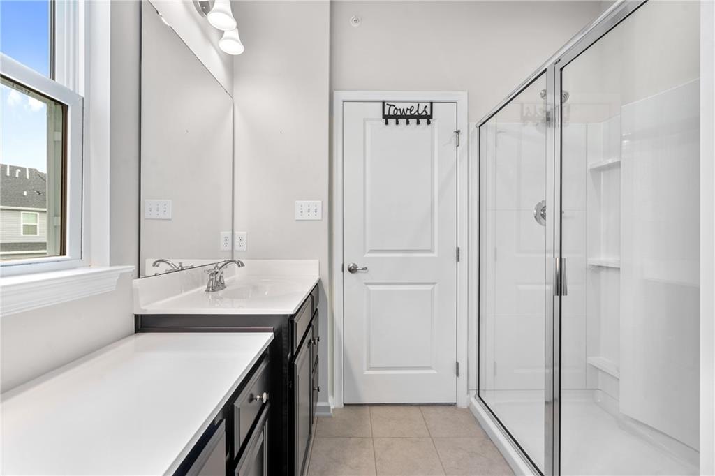 327 Helenium Drive Mars, PA 16046 - Photo 19 of 35 a bathroom with a double vanity sink and mirror with shower