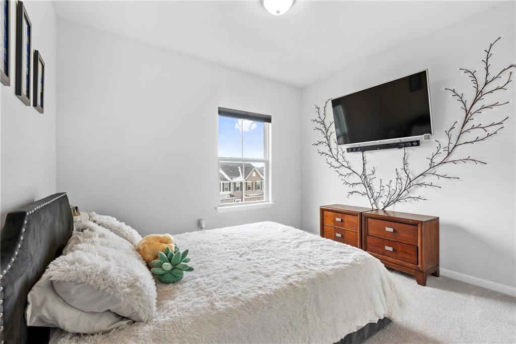 327 Helenium Drive Mars, PA 16046 - Photo 21 of 35 a bedroom with a bed and a flat screen tv