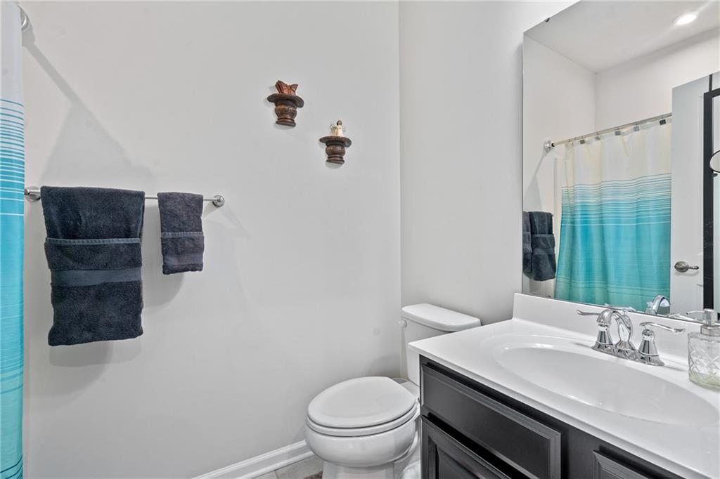 327 Helenium Drive Mars, PA 16046 - Photo 23 of 35 a bathroom with a granite countertop sink a toilet and a mirror