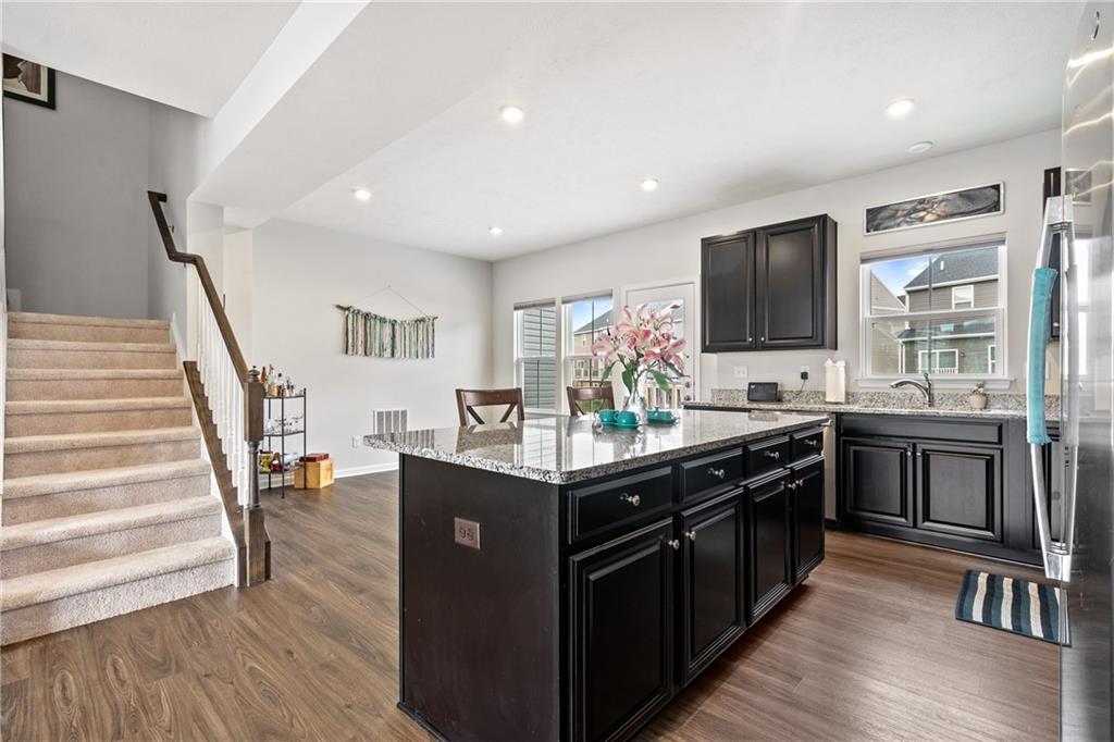 327 Helenium Drive Mars, PA 16046 - Photo 6 of 35 a kitchen with stainless steel appliances granite countertop a stove top oven and sink