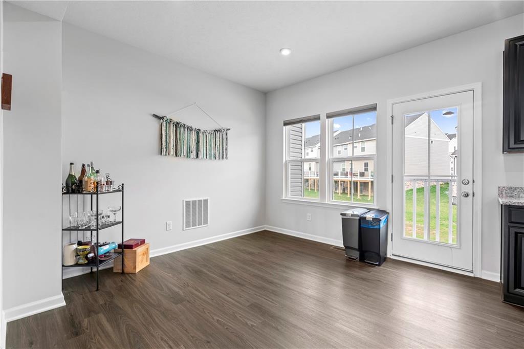 327 Helenium Drive Mars, PA 16046 - Photo 10 of 35 a view of an empty room with a window and wooden floor