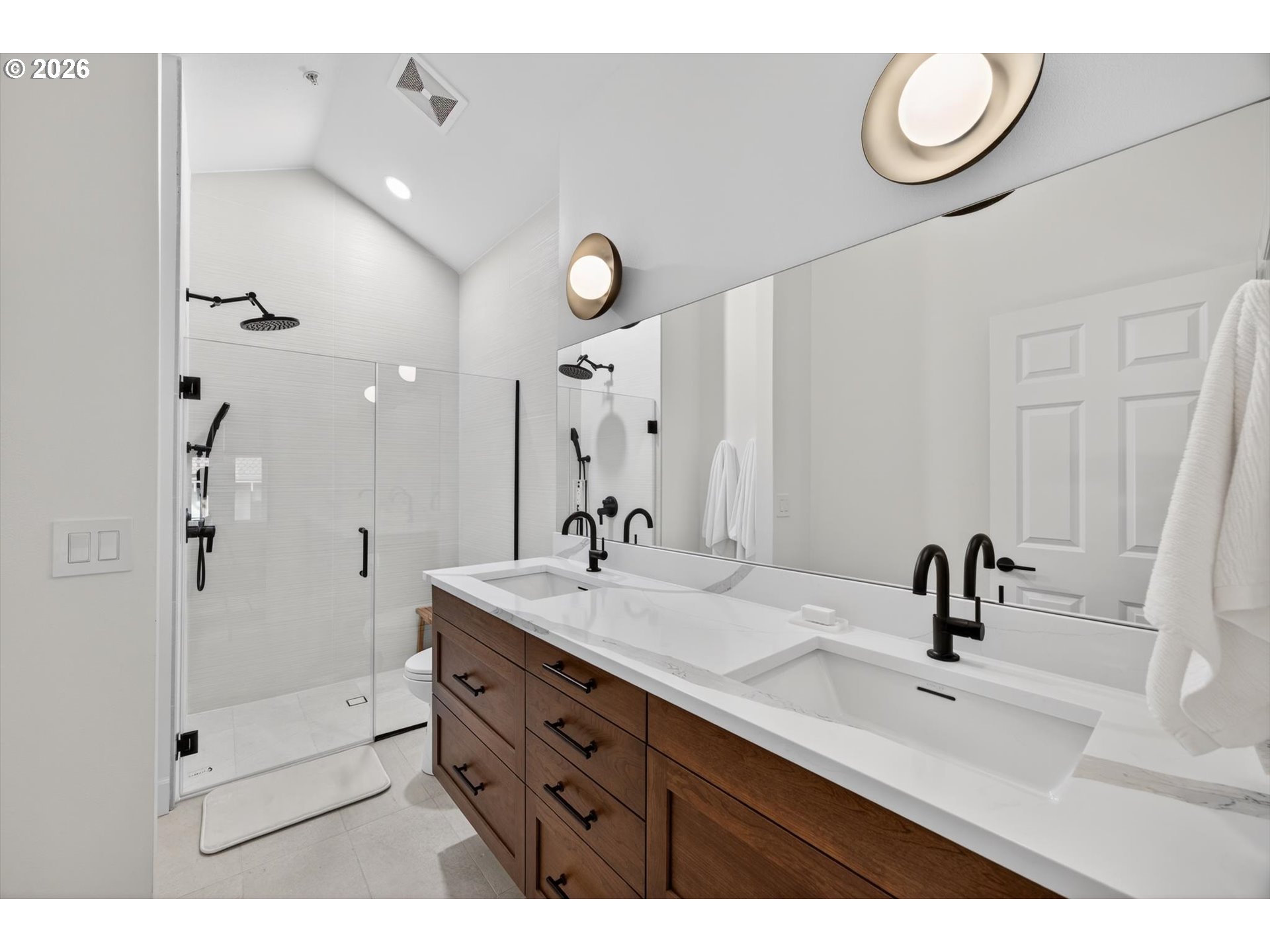 314 2nd Street Lake Oswego, OR 97034 - Photo 18 of 41 a bathroom with a sink a mirror a vanity and shower