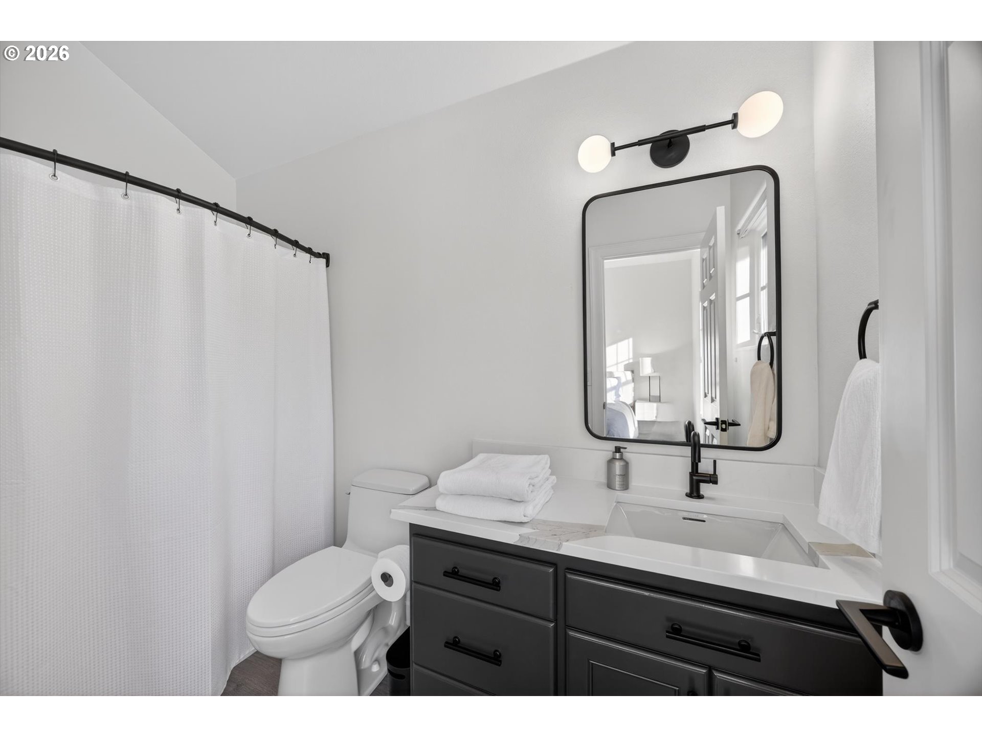314 2nd Street Lake Oswego, OR 97034 - Photo 22 of 41 a bathroom with a toilet sink and mirror
