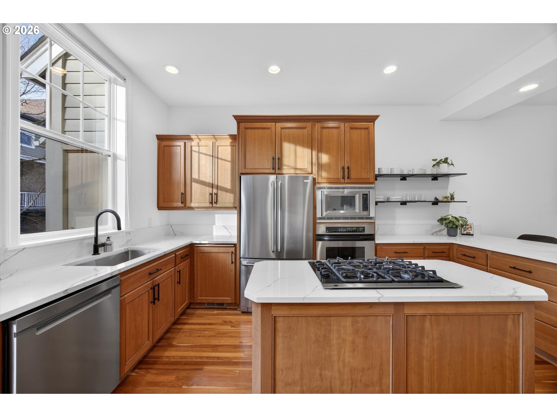 314 2nd Street Lake Oswego, OR 97034 - Photo 4 of 41 a kitchen with stainless steel appliances granite countertop a sink stove and refrigerator