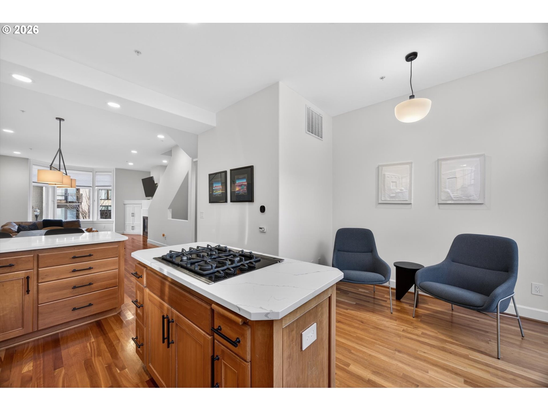 314 2nd Street Lake Oswego, OR 97034 - Photo 5 of 41 a kitchen with stainless steel appliances granite countertop a stove a sink dishwasher and white cabinets with wooden floor