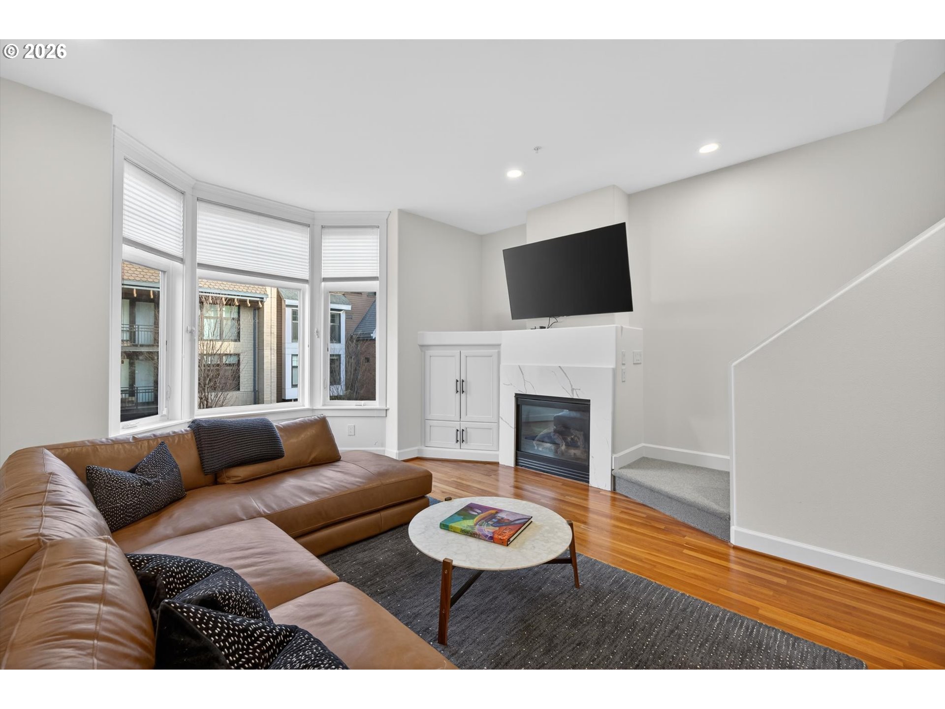 314 2nd Street Lake Oswego, OR 97034 - Photo 10 of 41 a living room with furniture a fireplace and a flat screen tv