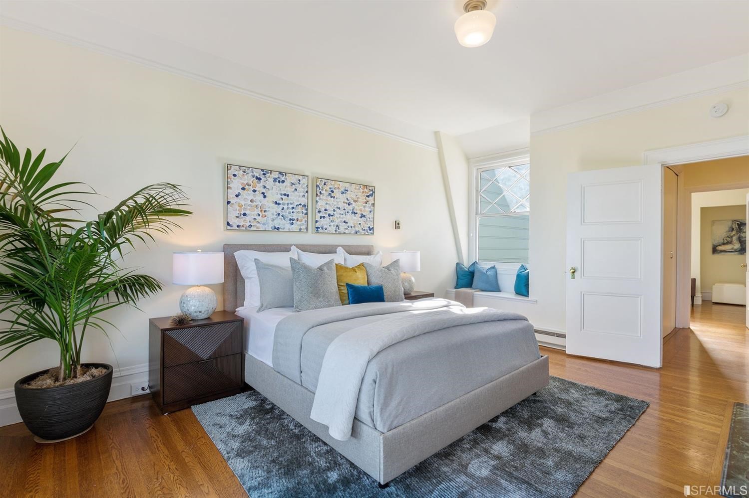 2526 Union Street San Francisco, CA 94123 - Photo 34 of 78 a bedroom with a bed and a potted plant
