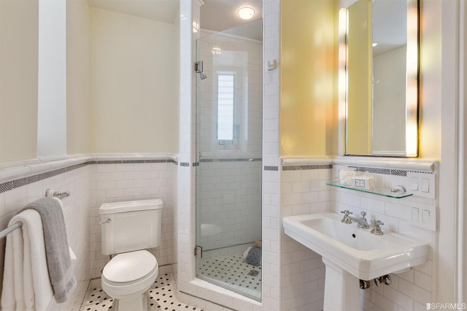 2526 Union Street San Francisco, CA 94123 - Photo 49 of 78 a bathroom with a sink a toilet and shower